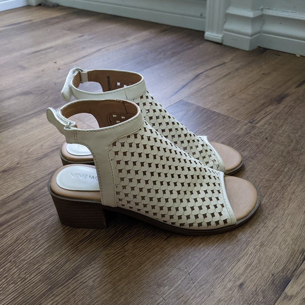White low heel sandals with heart pattern and ankle strap